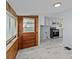 View of the kitchen with white cabinets, stainless steel appliances, and access to the outdoor area at 310 S Spencer Ave, Spencer, NC 28159