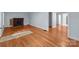 Living room with hardwood floors and a brick fireplace at 310 S Spencer Ave, Spencer, NC 28159
