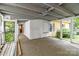 Covered porch with screen windows, ready for relaxing at 310 S Spencer Ave, Spencer, NC 28159