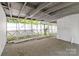 Large, covered porch with rustic wood beams overhead at 310 S Spencer Ave, Spencer, NC 28159