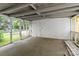 Spacious screened porch with white painted ceiling, concrete floor and view of the front yard at 310 S Spencer Ave, Spencer, NC 28159