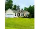 Charming single-story home featuring stone accents, manicured lawn, and attached two-car garage at 3110 Richards Way Dr, Rock Hill, SC 29732