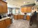 Open kitchen with granite countertops, stainless steel appliances, and wooden cabinetry at 3110 Richards Way Dr, Rock Hill, SC 29732