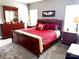 Well-lit main bedroom featuring a dark wood bedroom set and soft gray walls at 3110 Richards Way Dr, Rock Hill, SC 29732