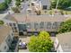 Aerial view of townhome community showcasing well-maintained buildings and parking at 408 N Mcdowell St, Charlotte, NC 28204