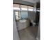 Modern bathroom featuring modern vanity with granite countertops and a glass door shower at 408 N Mcdowell St, Charlotte, NC 28204