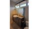 Stylish bathroom featuring modern vanity with granite countertops and a sleek vessel sink at 408 N Mcdowell St, Charlotte, NC 28204