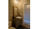 Modern powder room with gray vanity and vessel sink, complementing the elegant design at 408 N Mcdowell St, Charlotte, NC 28204