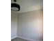 An ample bedroom with a modern chandelier and neutral walls awaits your personal touch at 408 N Mcdowell St, Charlotte, NC 28204