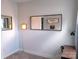 This home office space has carpeted floors, a mirror feature and unique light fixtures at 408 N Mcdowell St, Charlotte, NC 28204