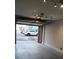 Garage features high ceilings, lighting and an electric door at 408 N Mcdowell St, Charlotte, NC 28204