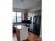 Well-lit kitchen featuring modern appliances, an island, and ample cabinet space at 408 N Mcdowell St, Charlotte, NC 28204