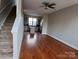 Open living space with hardwood floors next to the modern kitchen and staircase at 408 N Mcdowell St, Charlotte, NC 28204