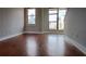 Bright living room features hardwood floors and large windows that let in natural light at 408 N Mcdowell St, Charlotte, NC 28204