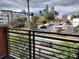 City skyline view from balcony showcasing parking, buildings, and neighborhood at 408 N Mcdowell St, Charlotte, NC 28204