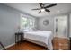 Serene bedroom with natural light, wood floors and ensuite bathroom at 409 S Grove St, Lincolnton, NC 28092