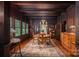 Elegant dining room features wood trim, wood floors, a patterned rug, and many windows offering natural light at 409 S Grove St, Lincolnton, NC 28092