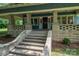 Inviting front porch with classic stone columns and stairway, leading to the front door at 409 S Grove St, Lincolnton, NC 28092