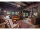 Elegant living room featuring hardwood floors, coffered ceilings and multiple windows at 409 S Grove St, Lincolnton, NC 28092