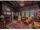 Inviting living room featuring a classic fireplace, hardwood floors and detailed woodwork at 409 S Grove St, Lincolnton, NC 28092