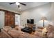Cozy living room featuring a barn door, plush seating, and hardwood floors at 409 S Grove St, Lincolnton, NC 28092