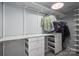 A well-organized walk-in closet features ample shelving and drawers for clothing and accessories at 409 S Grove St, Lincolnton, NC 28092