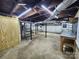 Unfinished basement with concrete floor and exposed beams, offering potential for customization at 423 N Cedar St, Lincolnton, NC 28092