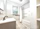 Traditional bathroom with a combined bathtub and shower, complemented by a stylish sink at 423 N Cedar St, Lincolnton, NC 28092