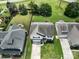 Aerial view of the house showcasing its well-manicured lawn, driveway, and proximity to neighboring properties at 4915 Juniper Grove Sw Ct, Concord, NC 28027