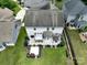 An aerial view of the backyard showcasing a patio, pergola, landscaping, and the layout of the property at 4915 Juniper Grove Sw Ct, Concord, NC 28027