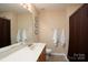 Bathroom with a large vanity, a toilet, and a shower with a curtain at 4915 Juniper Grove Sw Ct, Concord, NC 28027