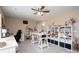 Bedroom with ceiling fan and a wall mounted book shelve at 4915 Juniper Grove Sw Ct, Concord, NC 28027