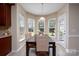 Cozy dining area featuring natural light, and a view of the backyard at 4915 Juniper Grove Sw Ct, Concord, NC 28027