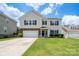 Charming two-story home with a well-manicured lawn, two car garage, and welcoming front porch at 4915 Juniper Grove Sw Ct, Concord, NC 28027