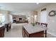 Open-concept kitchen view of a living room with a beautiful fireplace at 4915 Juniper Grove Sw Ct, Concord, NC 28027