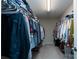 Spacious walk-in closet with ample storage and organization at 4915 Juniper Grove Sw Ct, Concord, NC 28027