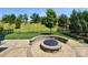Beautiful backyard with firepit area and green lawn overlooking the community at 5003 Looking Glass Trl, Denver, NC 28037