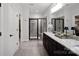 Modern bathroom featuring a sleek glass shower, granite countertops, and tile flooring at 5003 Looking Glass Trl, Denver, NC 28037