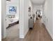 Bright hallway with wood floors and views into the bedroom and other living spaces at 5003 Looking Glass Trl, Denver, NC 28037