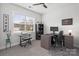 Bright home office with a large window, desk, and a comfortable chair at 5003 Looking Glass Trl, Denver, NC 28037