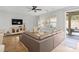 Cozy living room boasts hardwood floors, a ceiling fan, and access to an outdoor patio at 5003 Looking Glass Trl, Denver, NC 28037