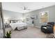 Bright bedroom with a ceiling fan, two windows, and a comfortable reading nook at 5003 Looking Glass Trl, Denver, NC 28037