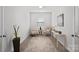 Bright sitting room with neutral décor, carpet, and view of window with blinds at 5003 Looking Glass Trl, Denver, NC 28037