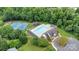 Overhead shot showing the community pool, clubhouse, tennis courts, and playground, all nestled in lush greenery at 508 Whitehead Ct # 328, Fort Mill, SC 29708