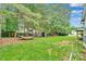 Spacious backyard with a hammock and storage shed surrounded by mature trees at 508 Whitehead Ct # 328, Fort Mill, SC 29708