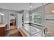 Luxurious bathroom featuring a soaking tub, a walk-in closet, and natural light at 508 Whitehead Ct # 328, Fort Mill, SC 29708