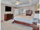 Bedroom with carpet flooring, a ceiling fan, a window, and access to the ensuite bathroom at 508 Whitehead Ct # 328, Fort Mill, SC 29708