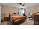 Bedroom featuring a dark wood bed frame, neutral walls, and a ceiling fan at 508 Whitehead Ct # 328, Fort Mill, SC 29708