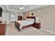 Bedroom with carpet flooring, a ceiling fan, a window, and access to the ensuite bathroom at 508 Whitehead Ct # 328, Fort Mill, SC 29708