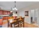 Open-concept dining area with views into the kitchen and laundry room, providing seamless living at 508 Whitehead Ct # 328, Fort Mill, SC 29708